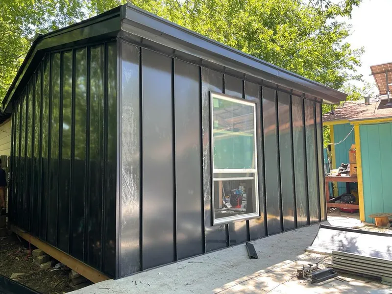 Black standing seam metal wall panels for Roof Inspection in Bessemer City